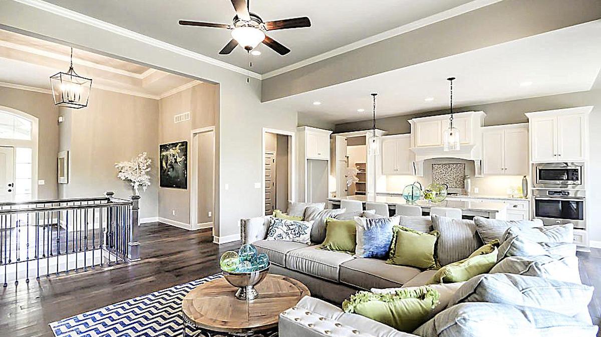 In Rodrock Development’s Forest View, James Engle outdid himself with the Sanibel Reverse, which sits on a cul-de-sac lot backing to trees and meadows. The home boasts a spacious Great Room with fireplace and large bank of windows looking out to the covered deck, complete with outdoor fireplace. An expansive lower level has a wonderful wet bar and versatile areas allowing for multiple entertainment options.