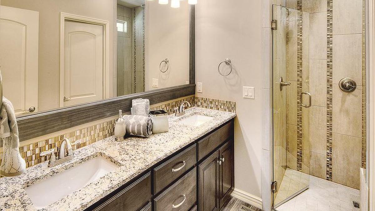 Homes from Summit’s award-winning Villa Collection feature luxury features including custom-tiled zero-entry showers in the master bathroom.