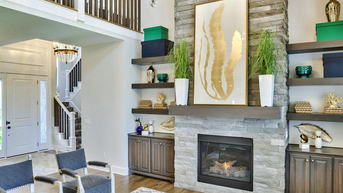 The five-bedroom, 1.5-story Anthem in Rodrock Homes Summerwood community features an open concept main level, with a stunning great room suited for any occasion. Anchored by a bank of windows, the centralized great room separates the entertaining space from the master quarters.