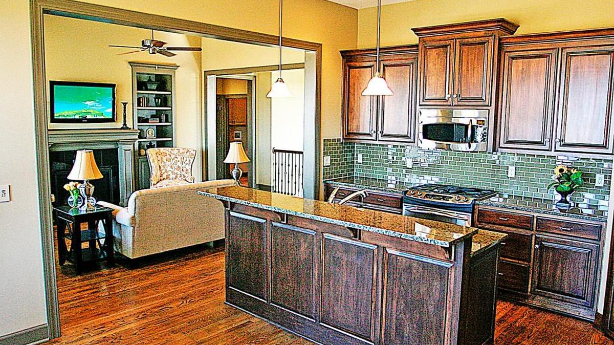Standard finishes of the Lime Stone Road Townhomes include custom cabinetry, granite counter tops, hardwood floors and GE appliances.