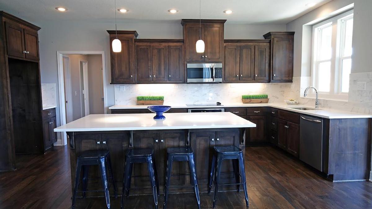 Hills of Forest Creek’s Destin EX, similar to this floor plan, is available for immediate purchase (and can be built in other Rodrock Homes communities). The home’s generous kitchen opens onto the great room, creating space for memorable family gatherings and entertaining ($485,500).