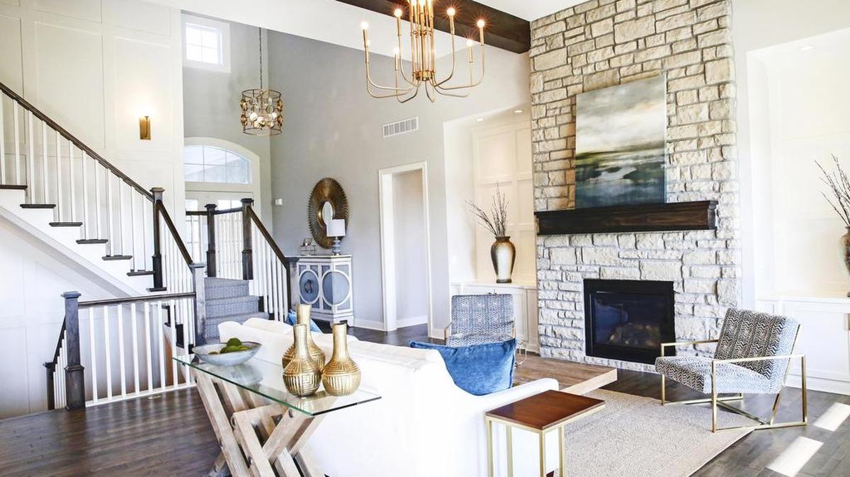 Rodrock Development’s Mill at Riverstone is a must-see during the Fall Parade of Homes. On tour is the outstanding 1.5-story Windermere by BCI-Bowen Custom Homes. This brand new plan offers an impressive 2-story entry, which opens up to the inviting, beamed Great Room. The gourmet kitchen boasts a huge island, amazing cabinetry, sensational pantry with second oven and a handy flex room behind the kitchen area.