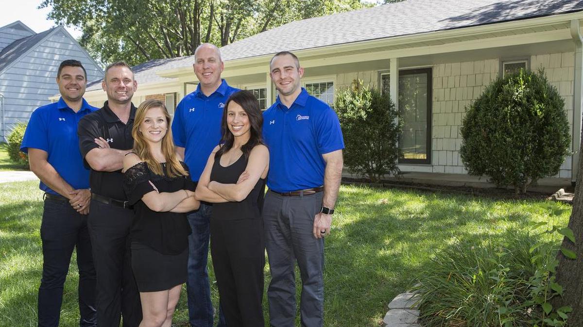 House Buyers KC’s unconventional approach to selling and buying real estate has prompted the company to expand. The team, from left to right, includes Kyle Walchshauser, Chad Lower, Jane Boyd, Tom Bell, Katie Mason and Brent Smith.