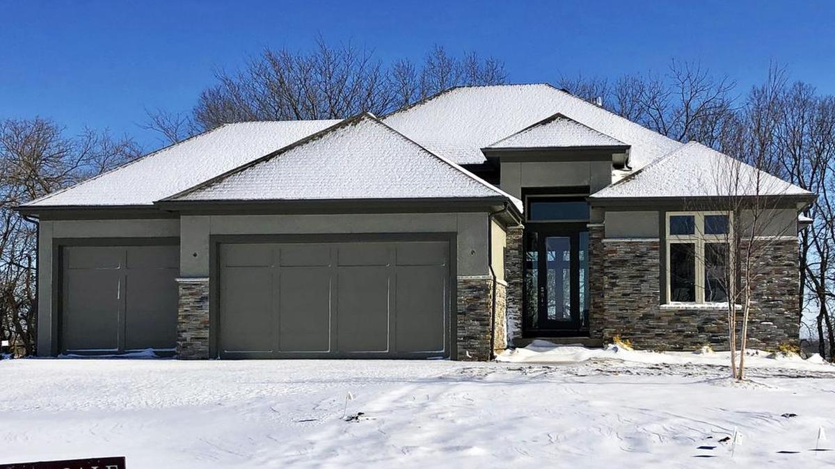 Nearing completion is this award-winning Encore Homes by Casa Bella Stanton reverse 1½-story. The home sits on a cul-de-sac location that backs to the east and features a covered deck and patio, a floor-to-ceiling tile fireplace, and a 9-foot granite kitchen island. The home is priced at $549,900 and has a 30-day close available.