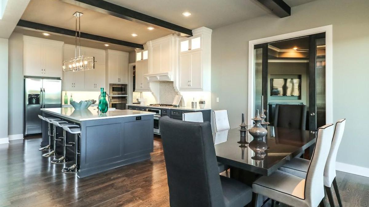 The award-winning 1.5-story Madison II in Stone Creek of Terrybrook Farms embodies sophisticated living, starting with the well-appointed gourmet kitchen.