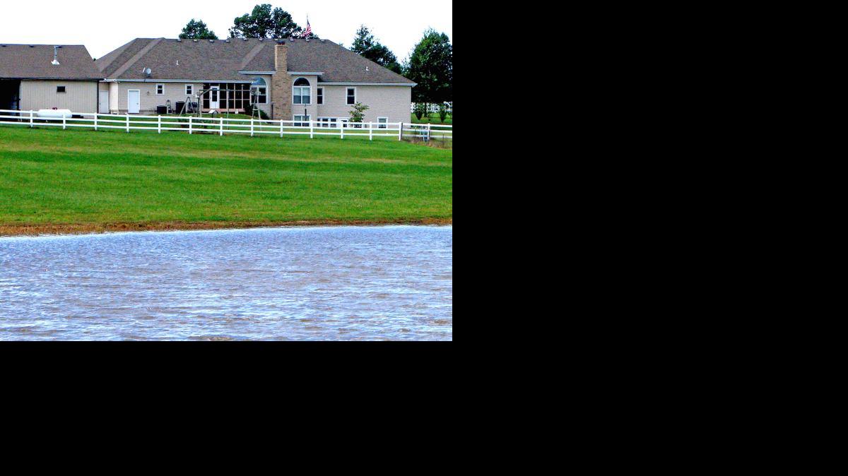 
This home just southwest of Harrisonville, Mo., is on 32 acres overlooking a three-acre stocked lake and pond surrounded by white fencing
