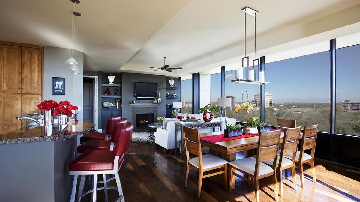 Dick and Karen Thurber designed their One Park Place condo with with clean modern lines, bold pops of color, unique chandeliers and interesting textures.