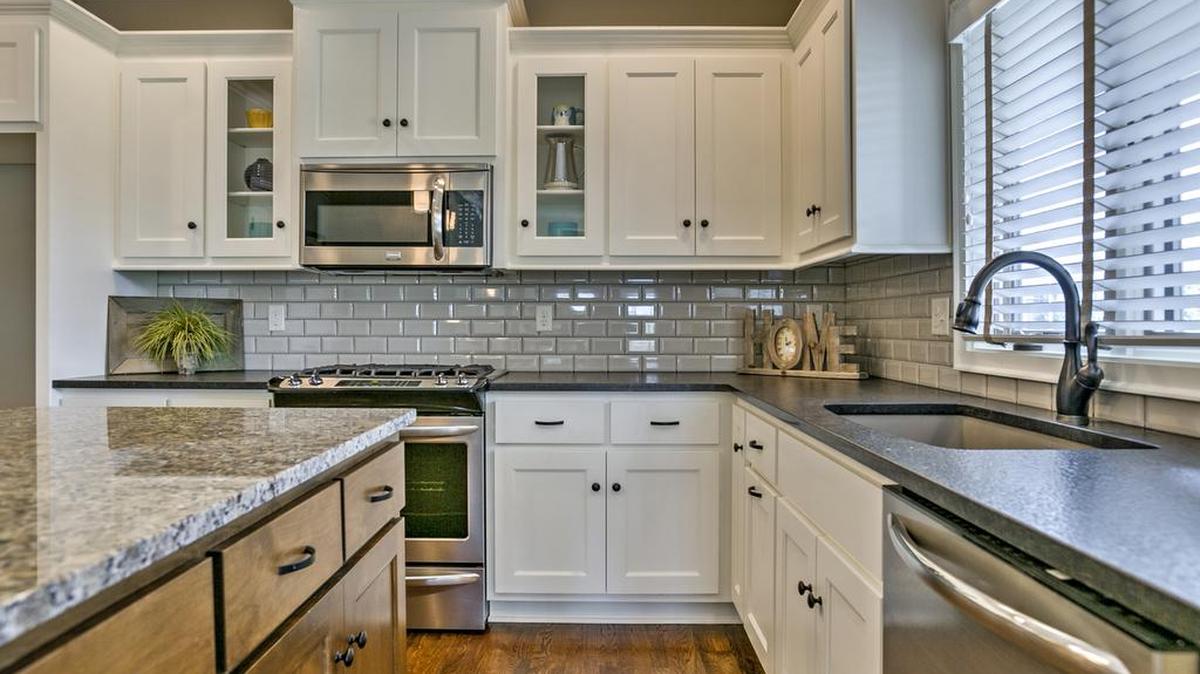 Custom cabinetry, granite countertops and hardwood floors are among the luxurious kitchen finishes offered at Covington Court.