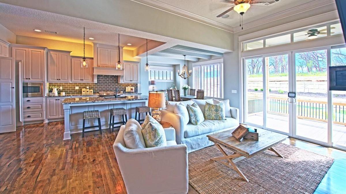On Fall Parade of Homes in Rodrock Development’s Forest View is the reverse 1 1/2-story Chesapeake II.1 by Hilmann Home Building. Boasting 4 bedrooms and 3 baths, this home features a kitchen with everything the established cook could want, including gorgeous granite countertops, a center island, custom cabinets, stainless appliances, and a huge walk-in pantry with a handy pass-through from the garage.