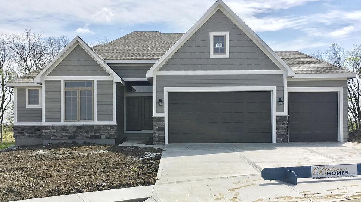 Bickimer Construction features this award-winning Jefferson reverse 1½-story plan nearing completion at 16809 Bradshaw with a covered deck, a see-through fireplace and a backyard to the east. The home is priced at $475,000 with 45-day delivery.