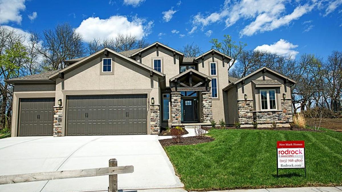 This gorgeous Scottsdale Expanded model by NewMark Homes is nestled on a treed lot in Rodrock Development’s Stonebridge Park in Olathe.