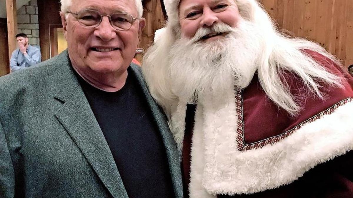 Darol Rodrock and Santa Claus at the Darol Rodrock Foundation Holiday Dinner & Sleigh Ride on Dec. 8 at the red barn at the Lodge of Ironwoods in Leawood. The Foundation went out of its way to make the 2016 holiday season one of surprise and joy for local foster-care youth.