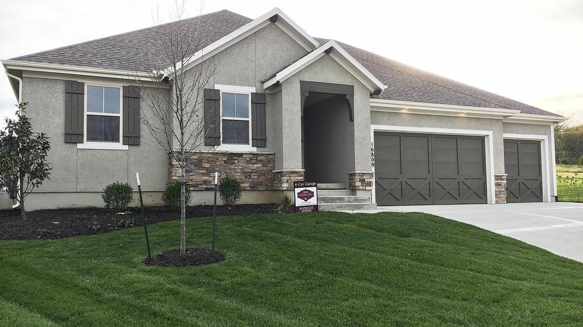 Rodrock Homes’ Augusta ranch reverse at 16809 Haskins St. features four bedrooms (three on the main level), a 4-car tandem garage and a covered patio. The home is priced at $468,750 with 30-day possession available.