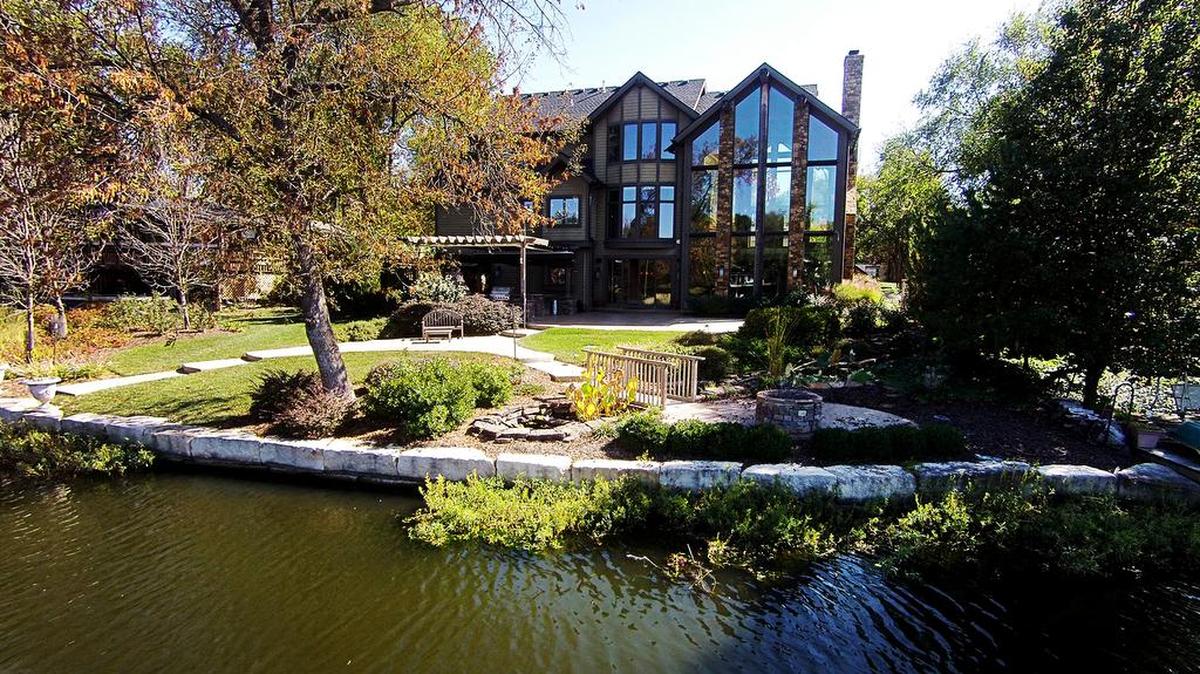 This custom-designed lake front home was last listed at $1.1 million, but will sell at auction to the highest bidder over $550,000.