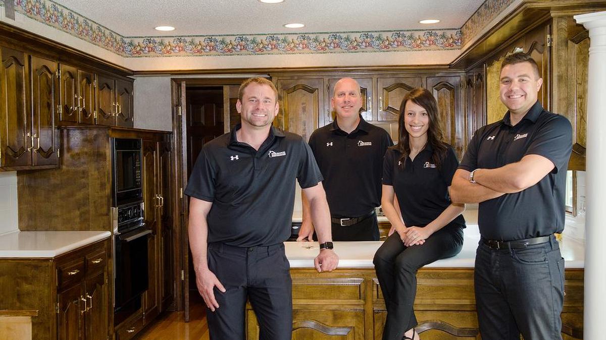The growing House Buyers KC team includes, from left: Chad Lower, Tom Bell, Katie Mason and Kyle Walchshauser.