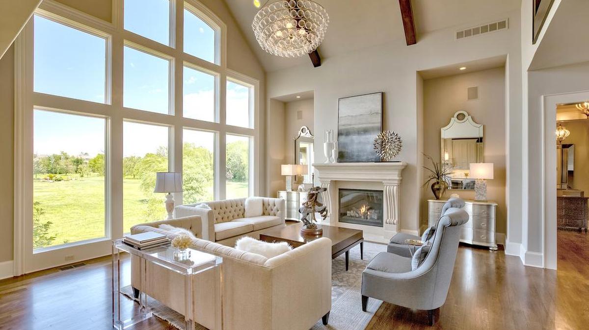 The Raphael is a grand estate home built by Rodrock Homes, massive in size and luxurious in features. The main level welcomes with an impressive great room with a window wall, vaulted ceiling and fireplace.