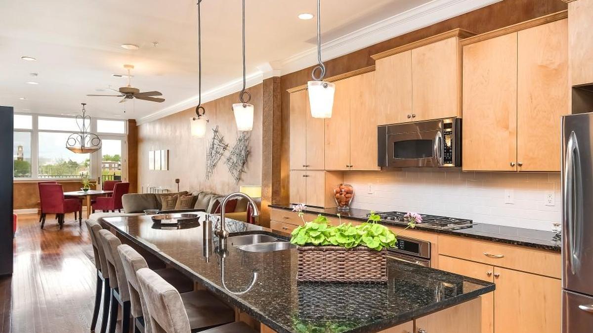 This two-bedroom, two-bathroom condo in the Greenlease Cadillac building boasts beautiful views of downtown from its third-floor space It has more than 1,500 square feet of living space and includes two garage parking stalls and one storage unit.