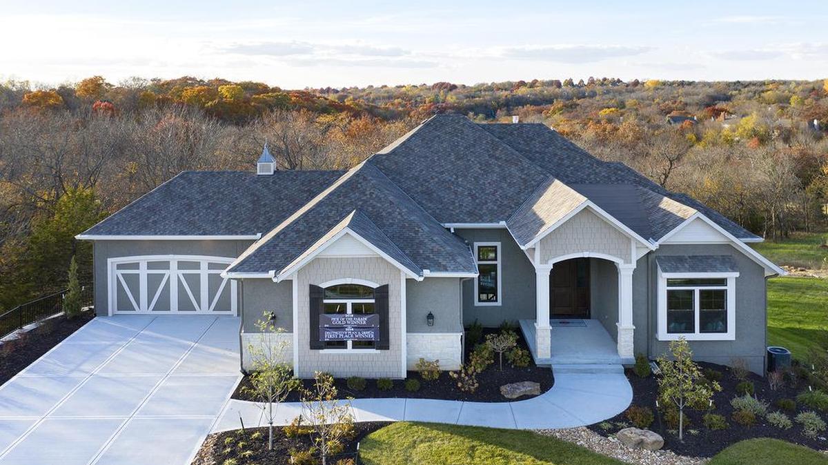 This four-bedroom reverse 1½-story home with four full bathrooms and two half-bathrooms is one of two immediately available homes in Cedar Creek’s luxurious Hidden Lake Estates.