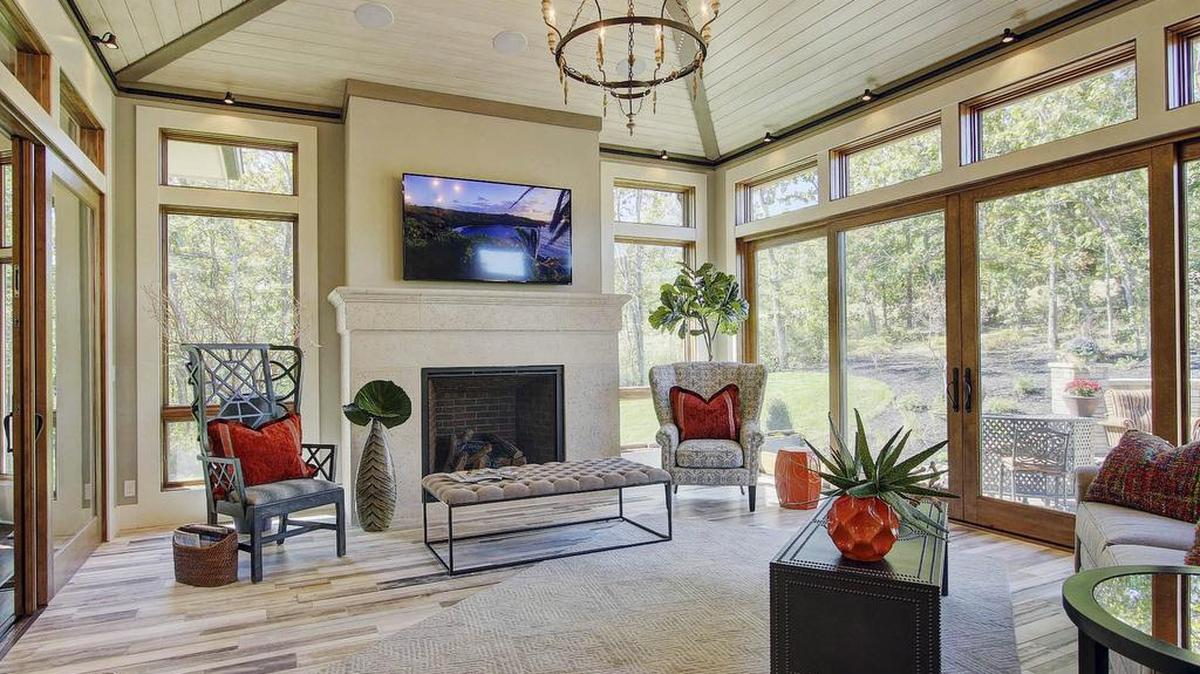 
This four-season room in the Willis Custom Homes entry on the Fall Parade of Homes has glass walls that open to bring the outdoors in.

