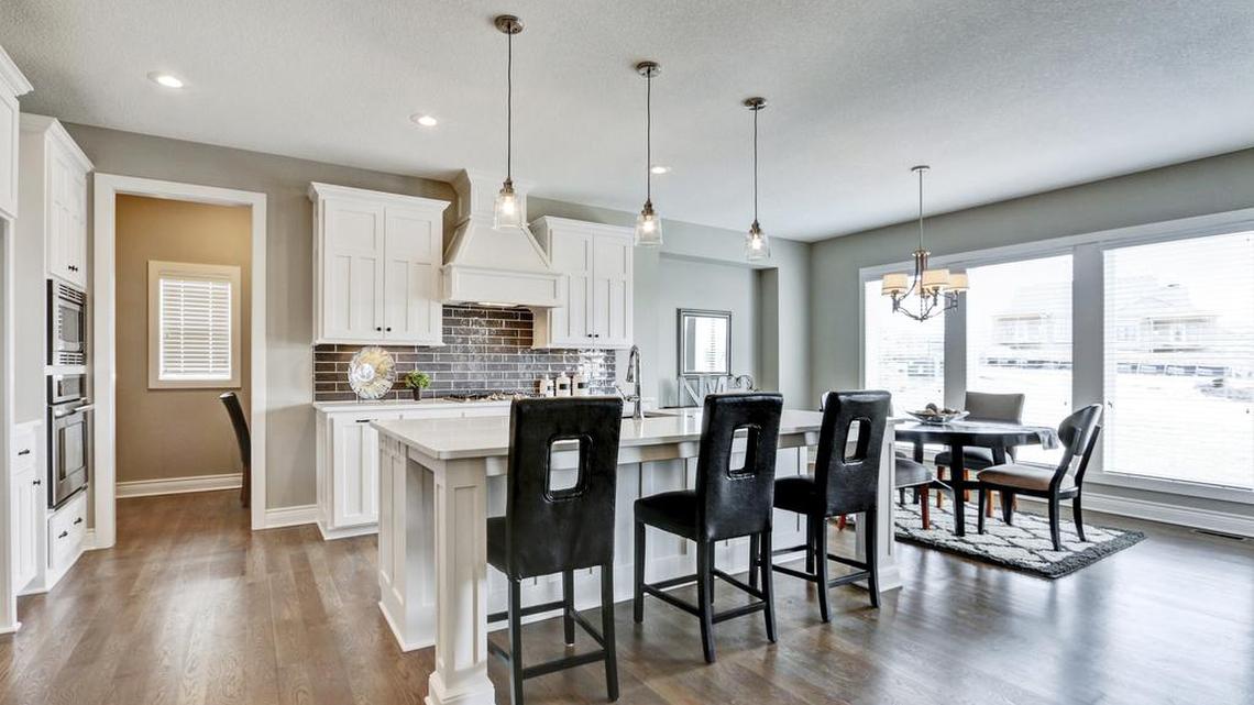 The model home by New Mark Homes features a well-appointed kitchen.
