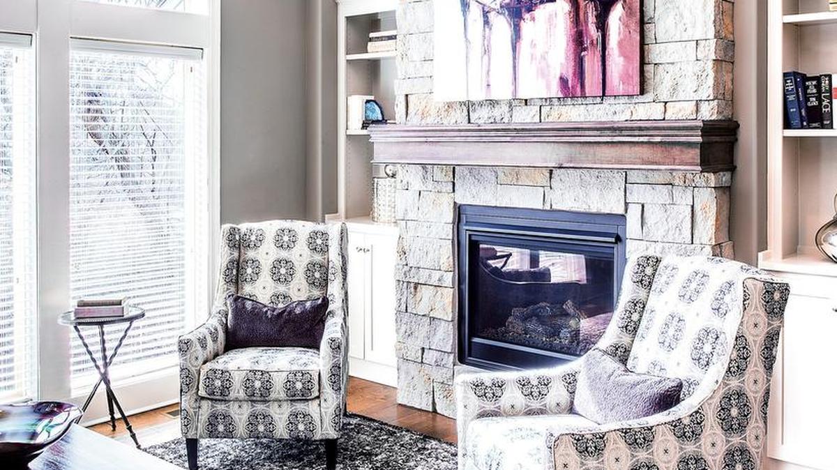 SAB Homes’ Augusta features a floor-to-ceiling stone fireplace, much like the one shown here.
