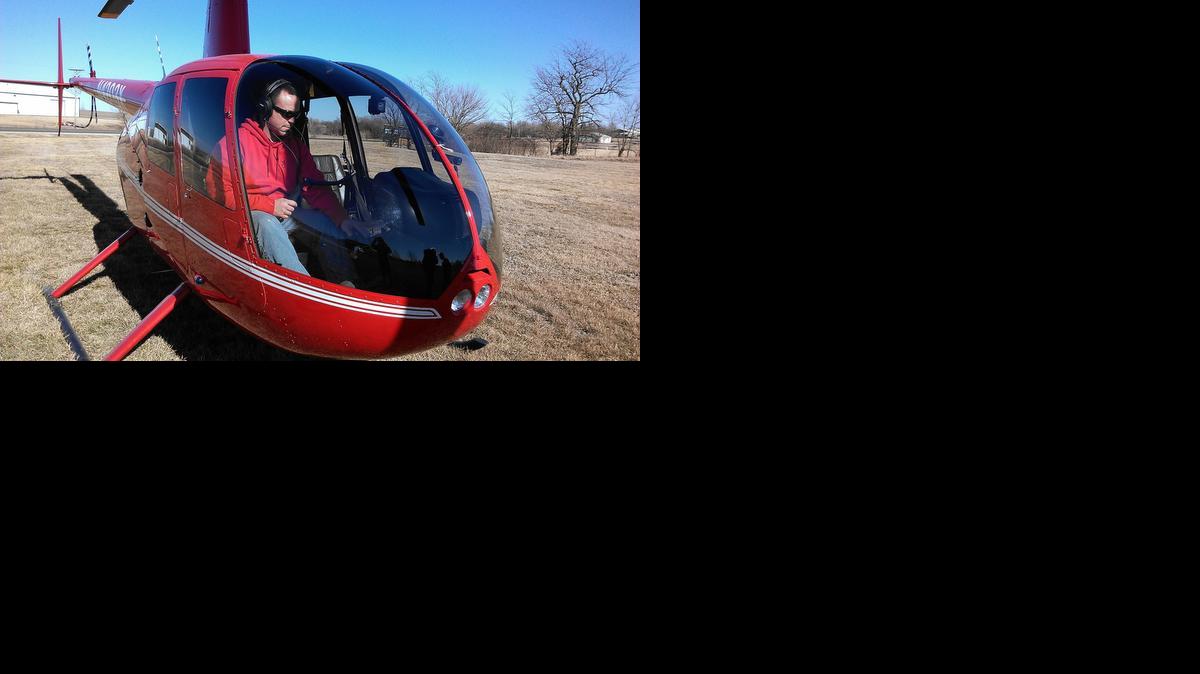 
Jamie Barnes is ready to take off in Barnes Realty’s helicopter to view farmland. 

