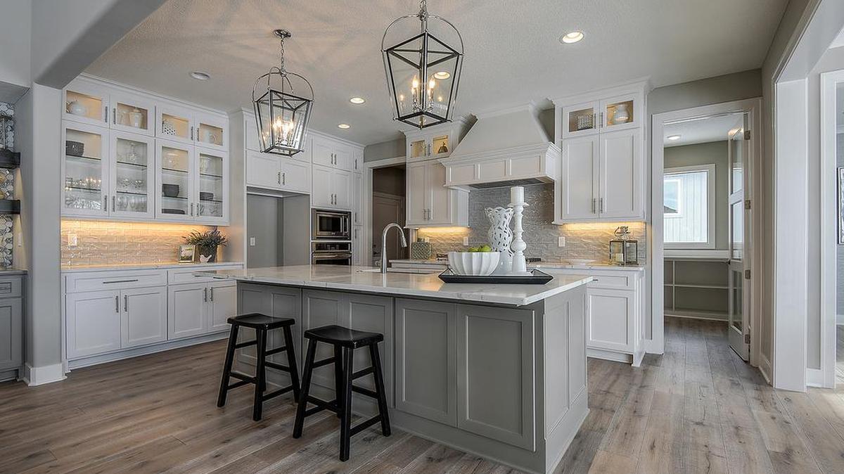 The Edgewood, a JS Robinson 1.5-story, four-bedroom show-stopping home boasts a home cook’s kitchen, complete with a large granite-topped islands and perimeter counters, sleek glass-front cabinets and an adjacent walk-in pantry. Purchase this award-winning, move-in ready home, which qualifies for the $10,000 Ridgestone Meadows Bucks program through May 31 (listed at $609,950).