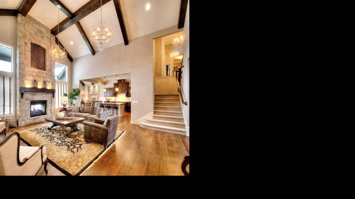 
The award-winning 1
1/2-story by Lambie Custom Homes located at 13428 W. 172nd St. features five bedrooms, including two on the first floor, four bathrooms, a loft, vaulted beam ceilings and a see-through fireplace to the covered deck. It is available for $527,810.
