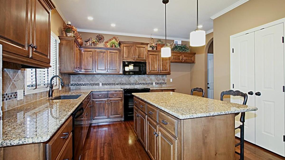 Custom cabinetry, granite countertops and hardwood floors are among the luxurious finishes featured in Tom French Homes’ gourmet kitchens.