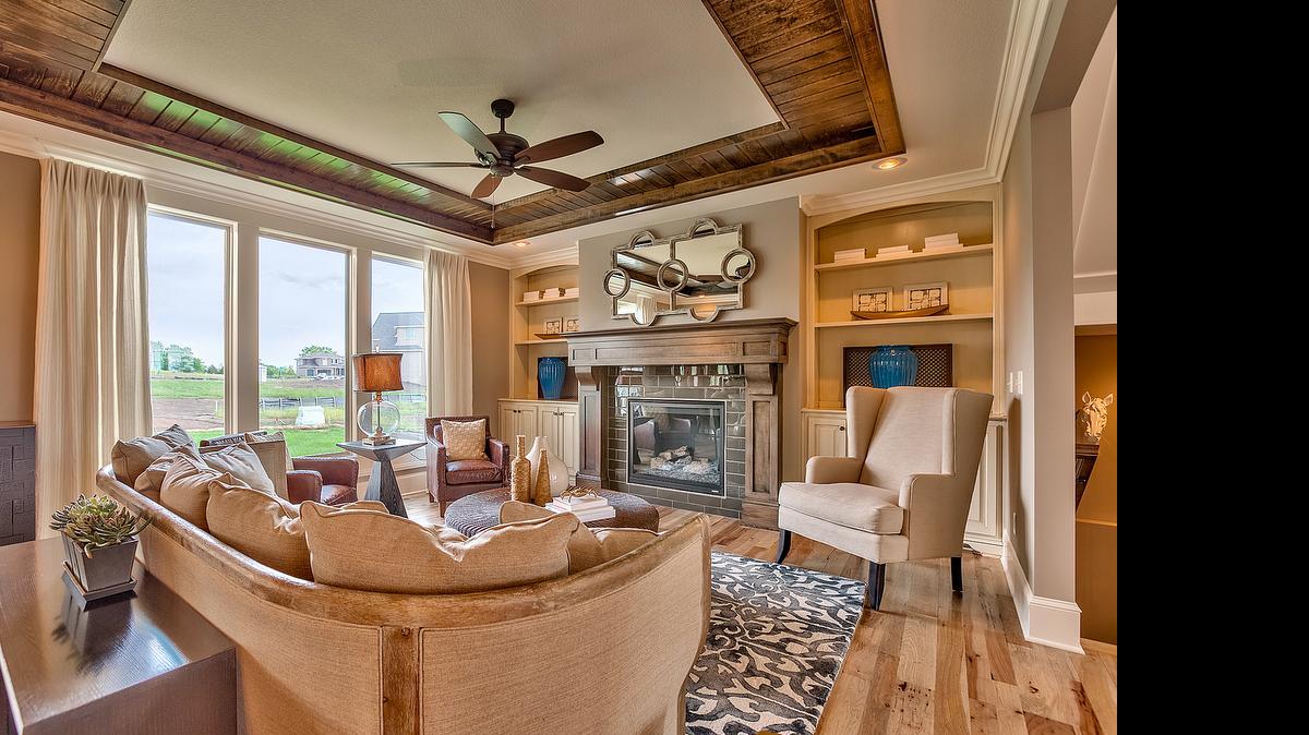 
The Larsen EX from Rodrock Homes features an open floor plan, including a well-appointed great room with built-in bookcases, fireplace, and a unique box-beam tongue-and-groove ceiling.
