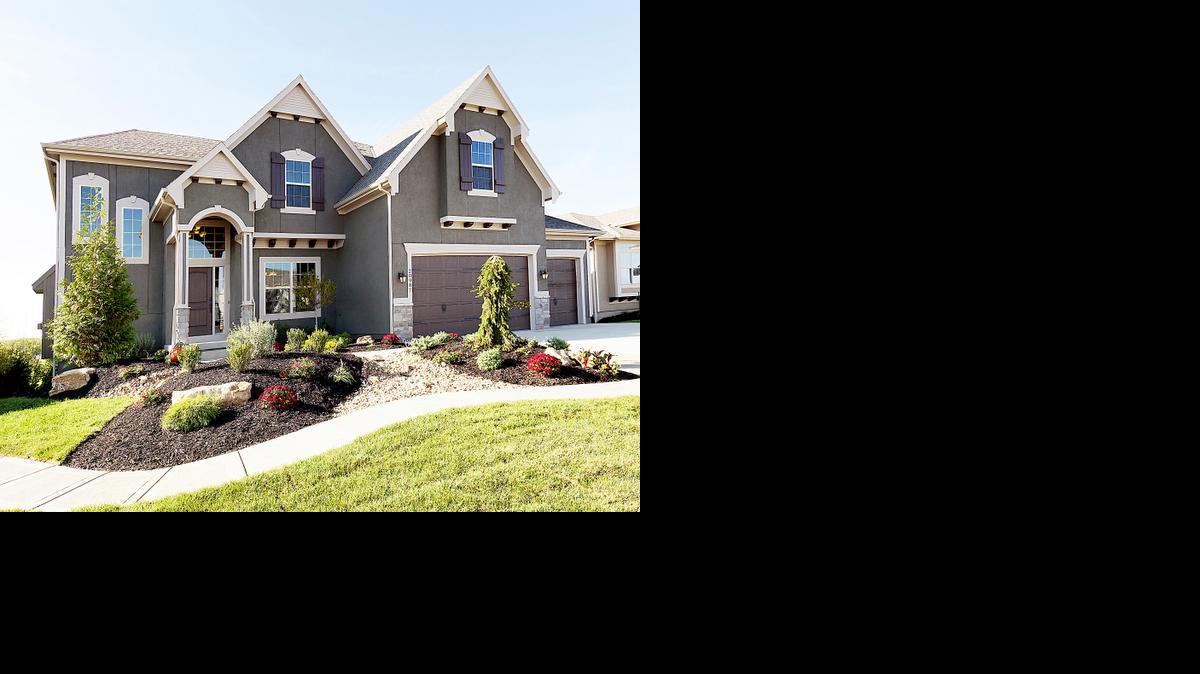 
Among Summit Custom Homes’ standard features are stucco and stone veneer front elevations and a three-car garages.
