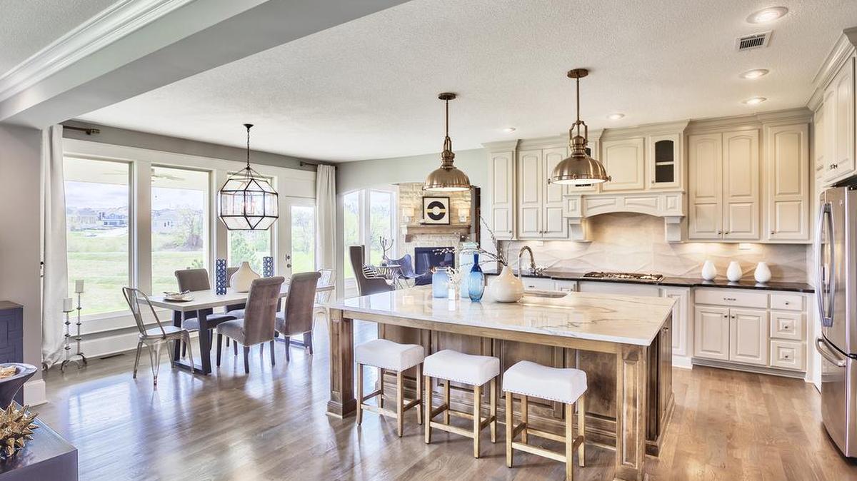 The two-story, four-bedroom Larsen EX in Wyngate features an open main level design with a spacious, gourmet-appointed kitchen ideal with for family dinners and entertaining. Visit this model during the Spring Parade of Homes.