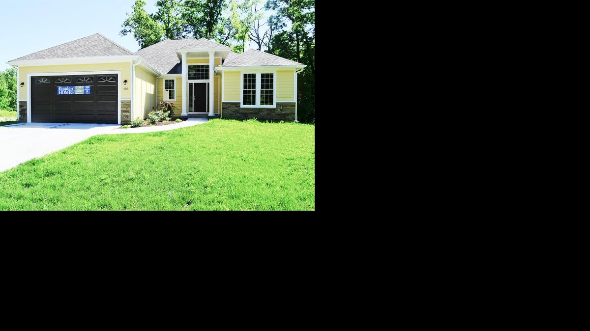 
AAA Exterior Remodeling built the Fairway Ridge Estate’s model at 409 E. 166th Court to take full advantage of the wooded views.
