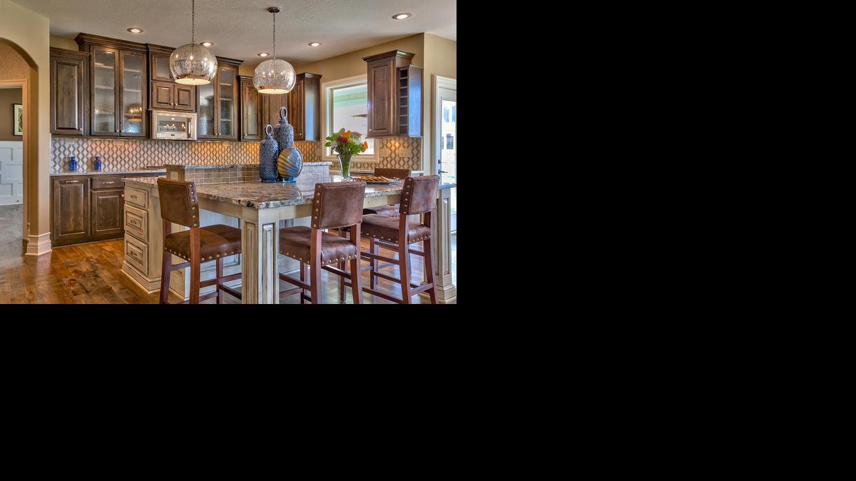 
Rodrock Homes’ Lancaster family of floor plans features well-appointed gourmet kitchens boasting an abundance of kitchen cabinets and a spacious island workspace to accommodate meal prep or after-school homework.
