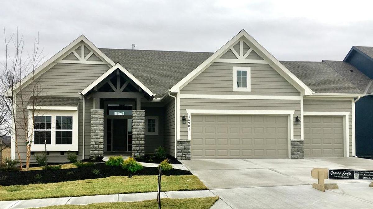 James Engle Custom Homes’ Emery reverse 1½-story located at 16901 Bradshaw St. features a covered deck, a walkout finished basement with walk-behind bar and a beautiful east-backing homesite, offered at $501,630.