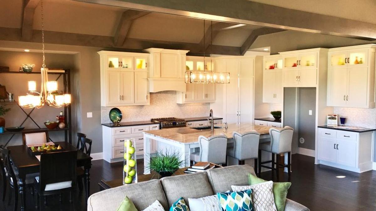 A designer kitchen is featured in Parkview Homes’ Broadmoor II reverse 1½-story model home located at 16704 Haskins. The home features vaulted beam ceilings, a screened porch with fireplace and a spa-inspired master bathroom.