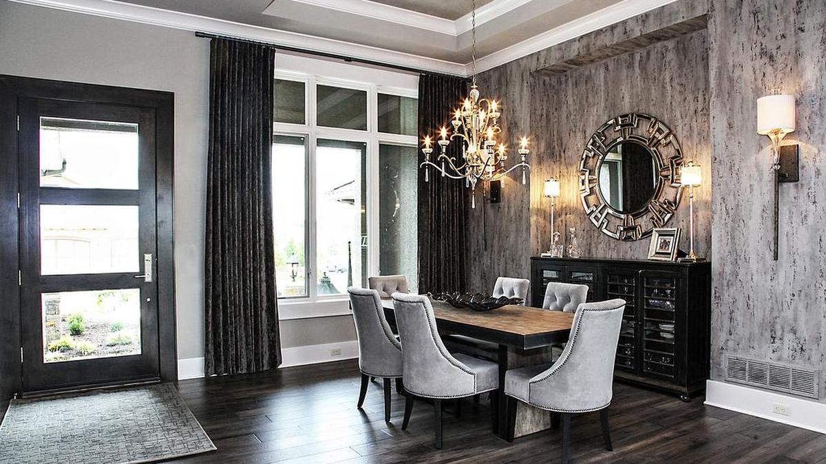 
The dining room of J.S. Robinson Fine Homes’ entry on the Artisan Homes tour showcases the unusual wall treatments found throughout as well as the gleaming hardwood floor.
