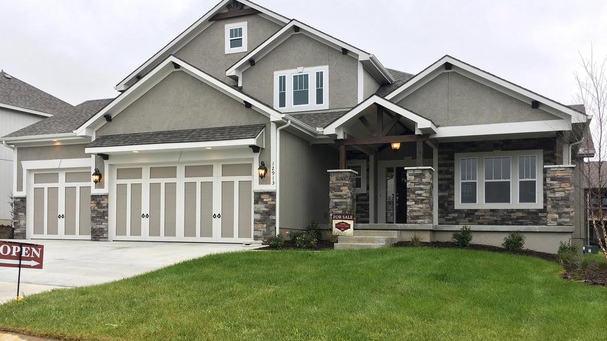 Nick Zvacek Construction’s Anderson 1½-story at 12913 W. 168th Street features a covered patio, a covered front porch and a first-floor master bedroom plus study/den. The home, priced at $448,500, backs to a greenspace area, has the basement framed in for quick finish and offers a 30-day close.