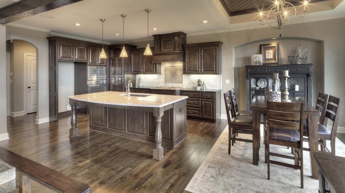 
Stunning quality cabinets and architectural kitchen details will be featured in the new Jefferson Reverse 1
1/2-story model home by Bickimer Homes at 16720 Haskins St. in Chapel Hill.
