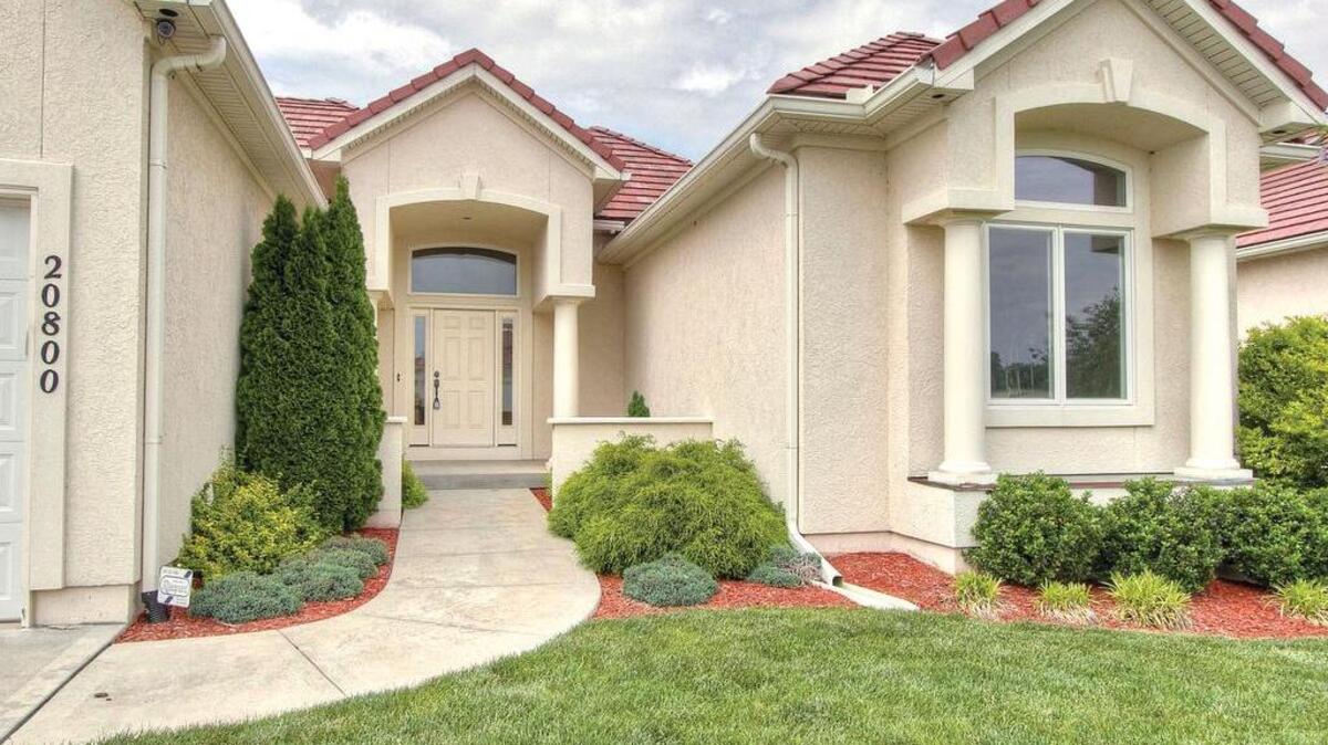 
The Saddle Ridge Villas model home at 20800 E. 37th Terrace Court South is now for sale, listed at $329,900. This ranch-style plan offers 1,860 square feet of space with three bedrooms, 2
1/2 bathrooms and a three-car garage. 
