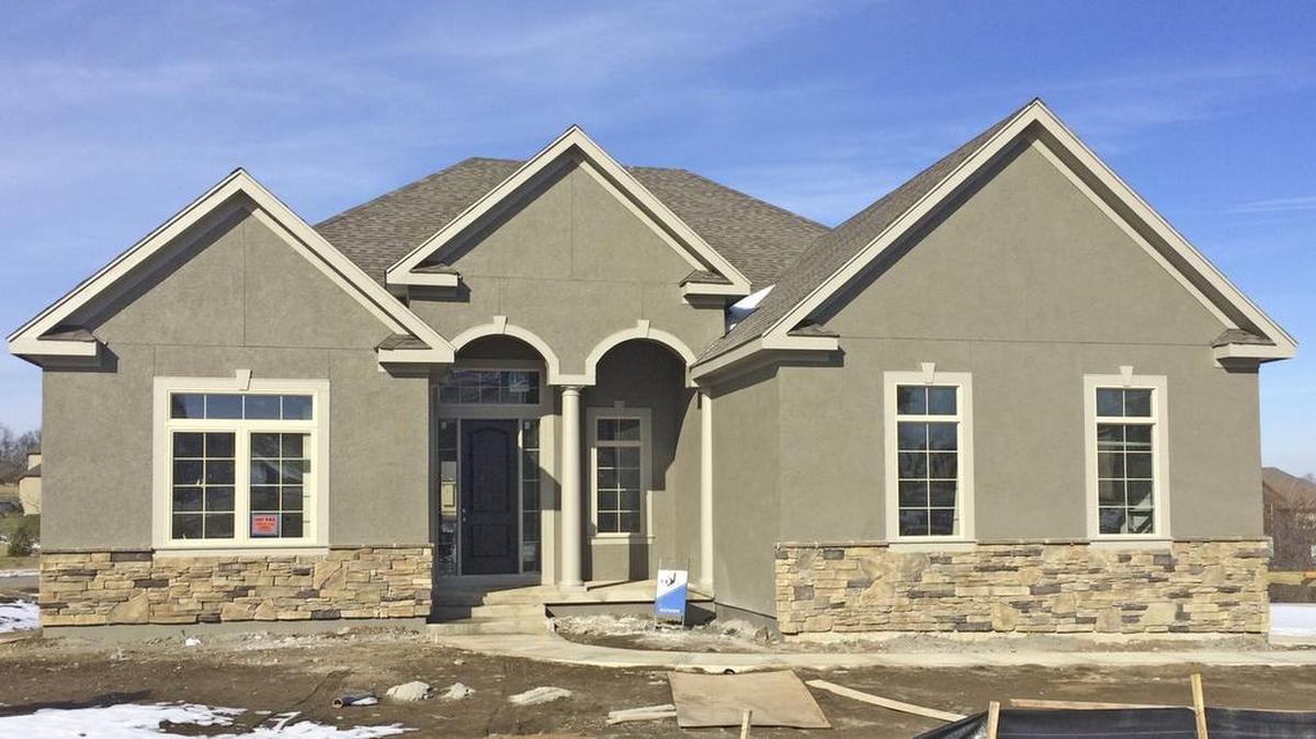 This award-winning expanded Broadmoor reverse 1 1/2-story by ParkView Homes is at 13320 W. 170th St. and features a walkout basement, side-entry three-car garage, formal dining room and backs to wooded green space. The home is priced at $517,847 with about a 60-day completion delivery.