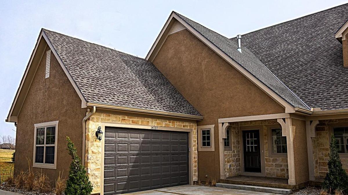 Full stucco and stone exterior brings out the cottage-like feel of the community. A 50-year roof and extra-wide 6-inch gutters will help maintain the longevity and beauty of each home.