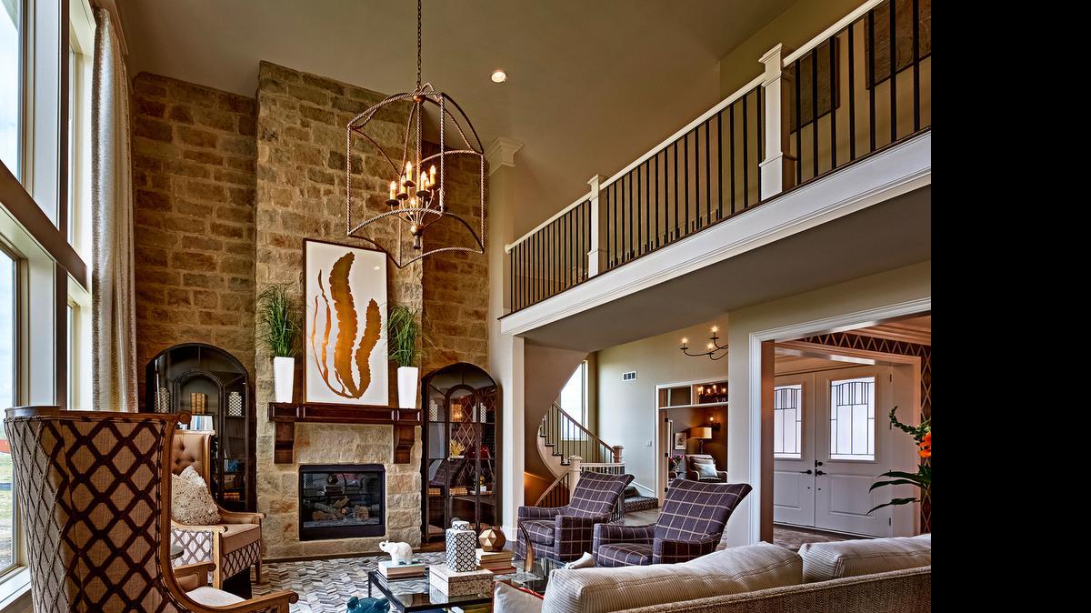 
This four-bedroom, 4
1/2-bathroom two-story home’s spacious great room boasts floor-to-ceiling windows and an extraordinary stone fireplace. The home’s floor plan is open and seamless, perfect for entertaining and family gatherings.
