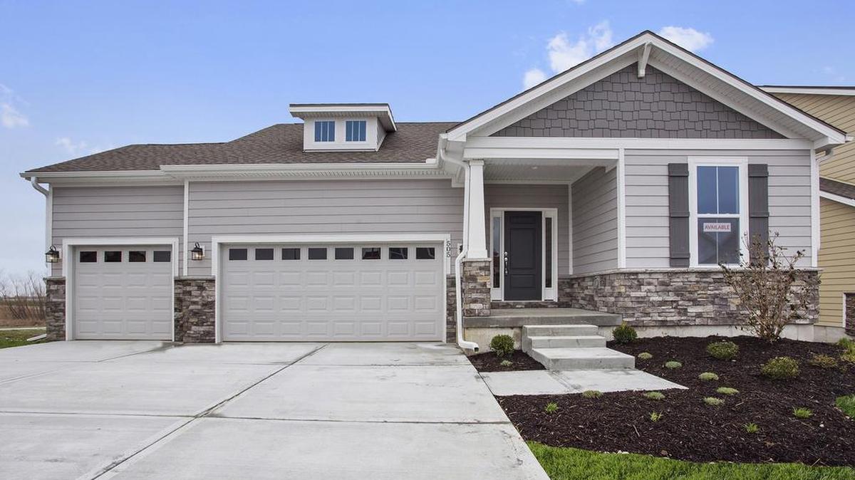 This reverse 1½-story Quintessa floor plan with three bedrooms and three bathrooms is move-in ready at Kessler Ridge at New Longview. Close on the home by August 30, 2018, and you’ll receive $5,000 to spend how you want at Nebraska Furniture Mart.