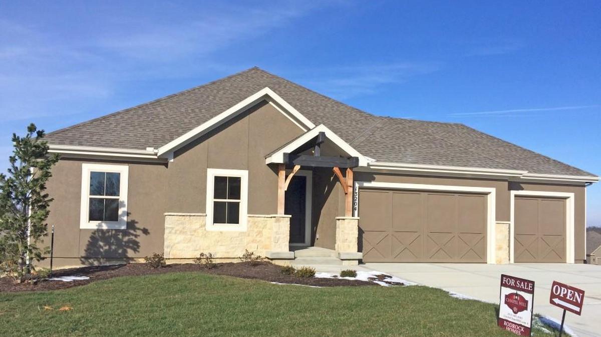 Rodrock Homes offers the Augusta Ranch reverse 1½-story located at 13204 W. 171st St. The home features four bedrooms (three on the first floor), a covered patio, a see-through fireplace between the great room and covered deck and a full finished walkout basement with bar. Priced at $435,000, the home includes 45-day delivery.