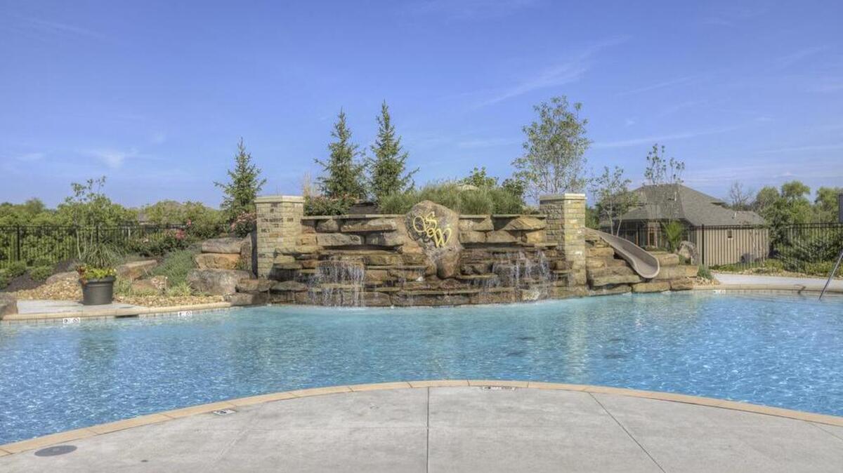 The resort-style pool and clubhouse are two popular amenities in Summerwood, Overland Park’s premier green space community, that attract discerning homebuyers.