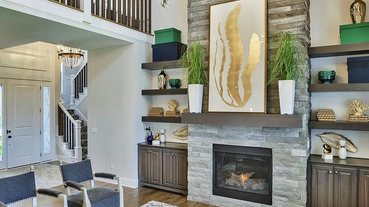 Family gatherings and casual entertaining are elevated in the Summerwood Anthem’s dramatic great room that features soaring ceilings and an exquisite floor-to-ceiling stone fireplace. This model is available for immediate move-in at $713,736.
