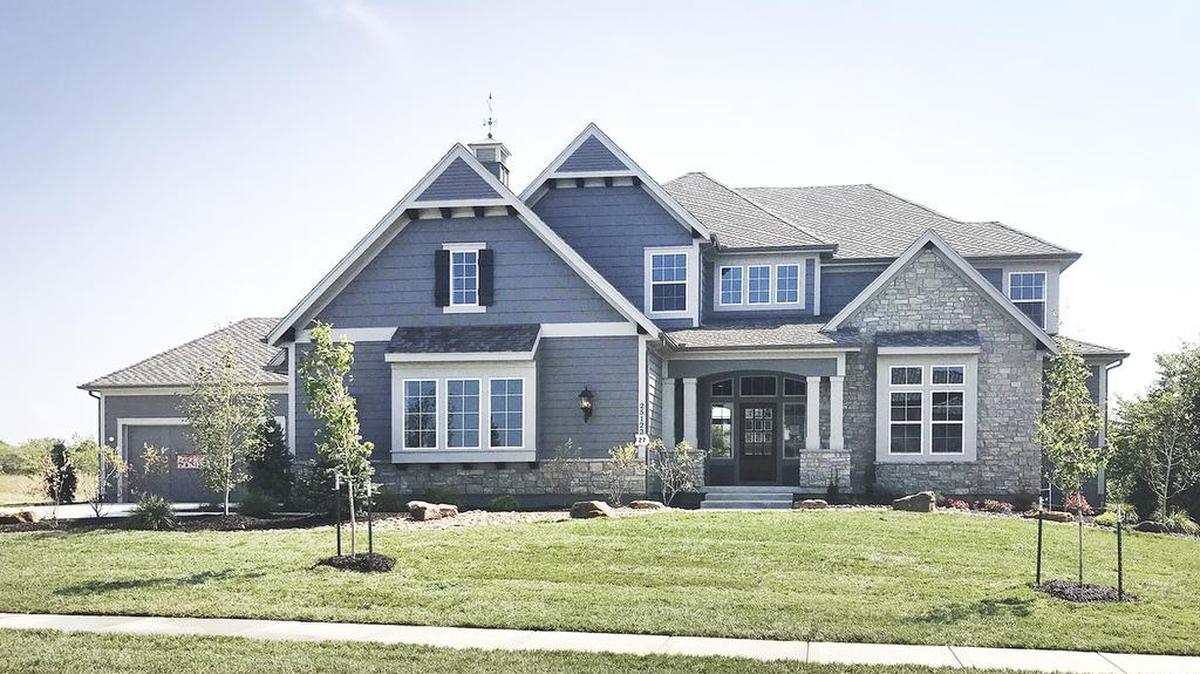 This lovely reverse 1½-story home from James Engle Custom Homes is one of several homes available in Cedar Creek. The five-bedroom Catalina home, priced at $982,130 is located in the newer Hidden Lake Estates neighborhood at 25123 W. 105th Terrace.