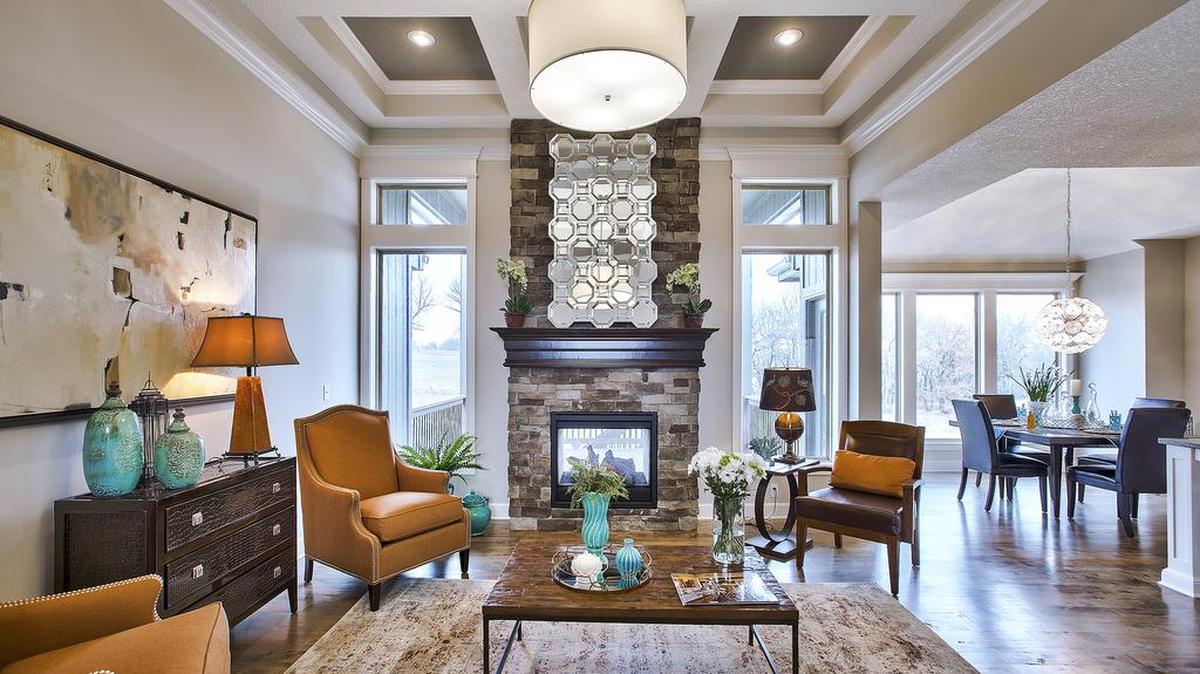 A reverse 1.5-story, The Dillon offers a main-level master suite, baths and stunning entertainment space. This Rodrock Homes floor plan can be built in Hills of Forest Creek in Lenexa.