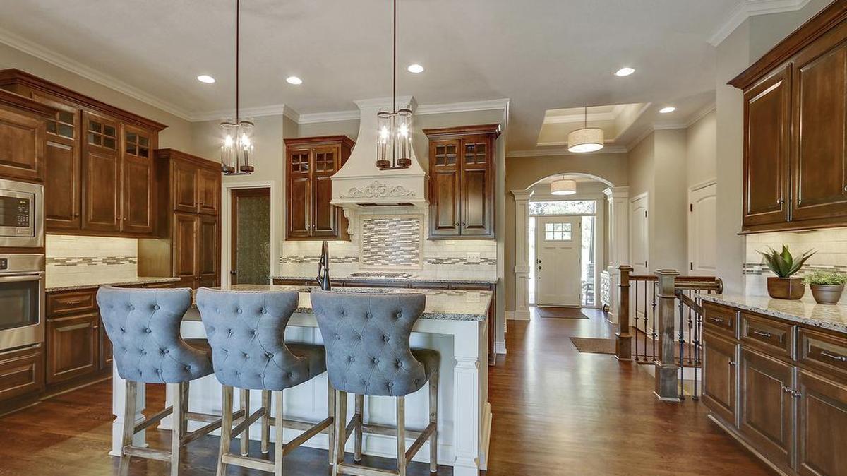 Custom cabinetry, granite countertops and hardwood floors are among the luxurious kitchen finishes offered at Covington Court.